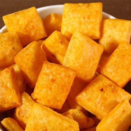 Spicy Cheese Crackers in a white bowl.