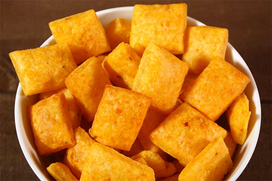 Spicy Cheese Crackers in a white bowl.