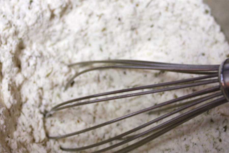 Dry ingredients whisked together in a bowl.