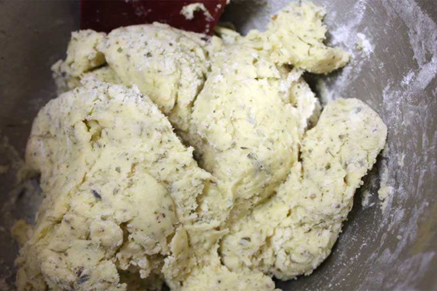 Savory Herb and Cheese Biscotti dough combined in a mixing bowl.