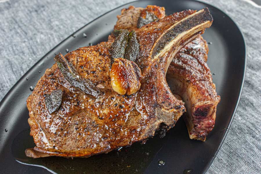 Simple ingredients and simple instructions on how to deliver a moist and juicy thick cut pork chop every time. #recipes #pork #porkchops