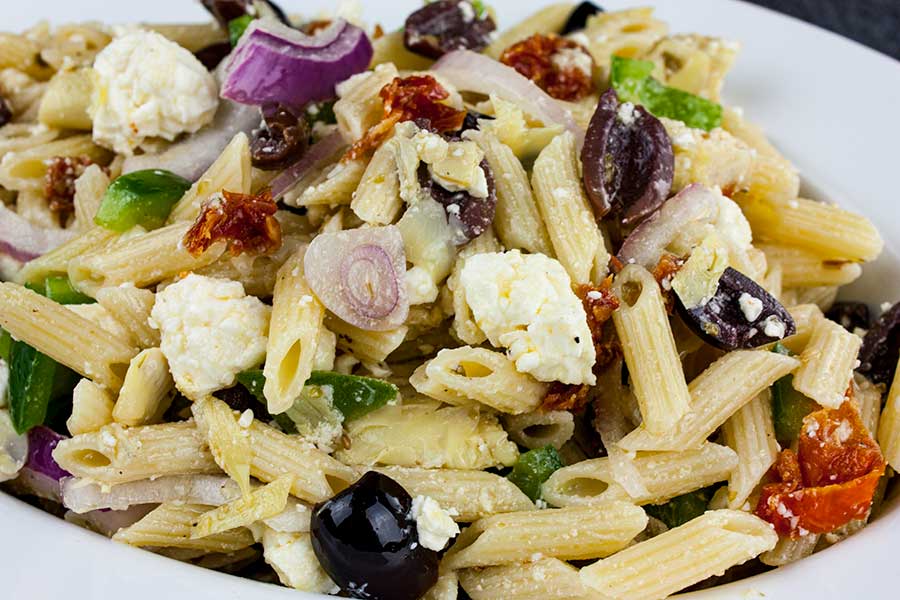 Greek Pasta Salad in a white bowl.