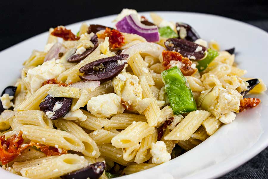 Greek Pasta Salad - A light, fresh, flavor-packed salad perfect for summer or any time of the year! Great to feed a crowd.