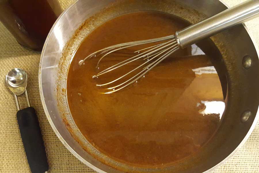 Pumpkin spice syrup in a sauce pan.