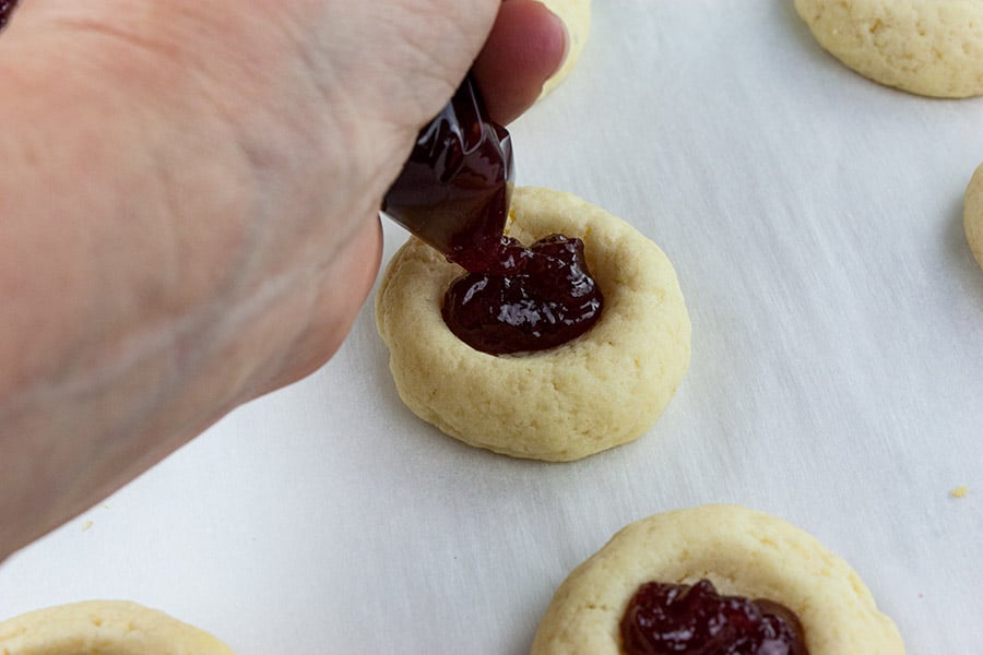 squeezing the jam into the indentations