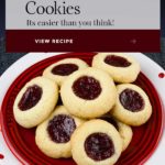 A soft, delicate, slightly crisp cookie base filled with sweet, tangy red raspberry jam! This easy Red Raspberry Thumbprint Cookie recipe is a Christmas tradition. #cookies #christmas