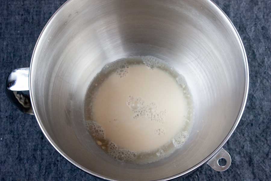 Yeast blooming in the bowl of a stand mixer.
