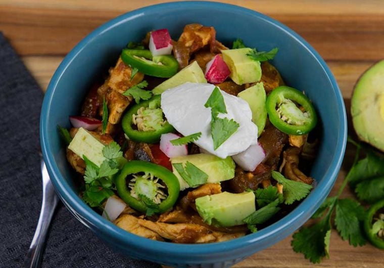 A blue bowl of chicken fajita stew