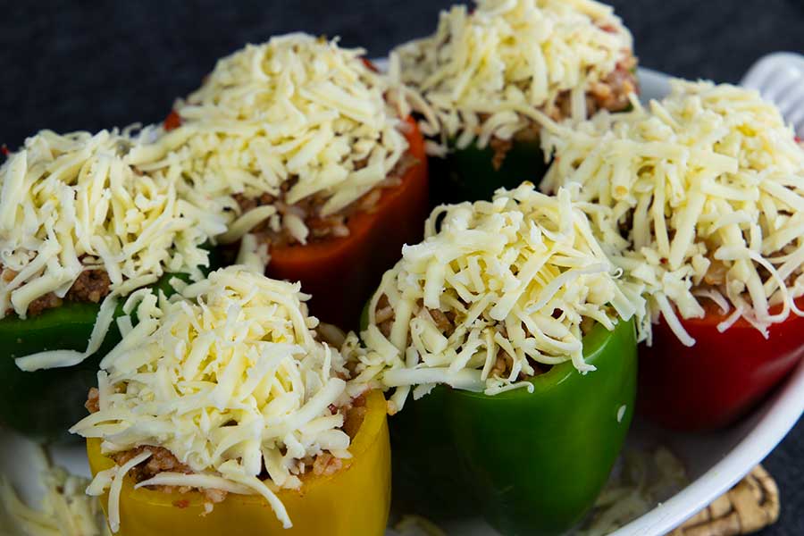 Stuffed bell peppers covered with cheese.