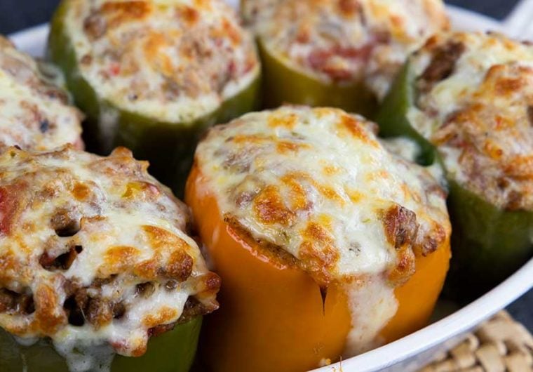Stuffed bell peppers in a white baking dish