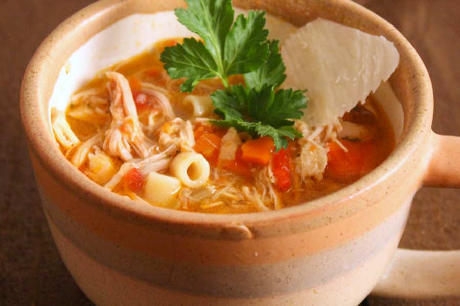 A cup of Sicilian chicken noodle soup.