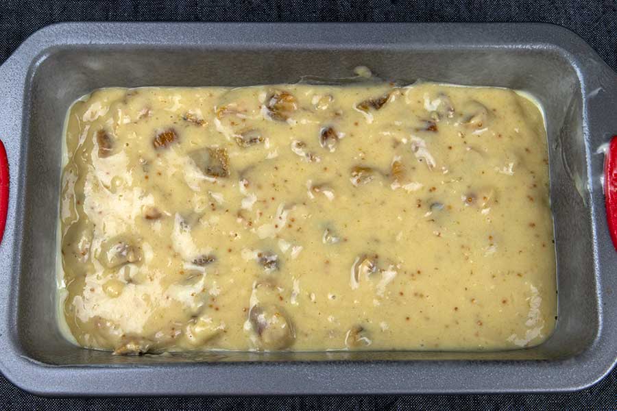 walnut fig bread batter in a loaf pan