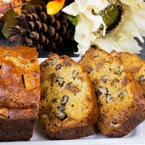 Walnut fig bread on a white platter.