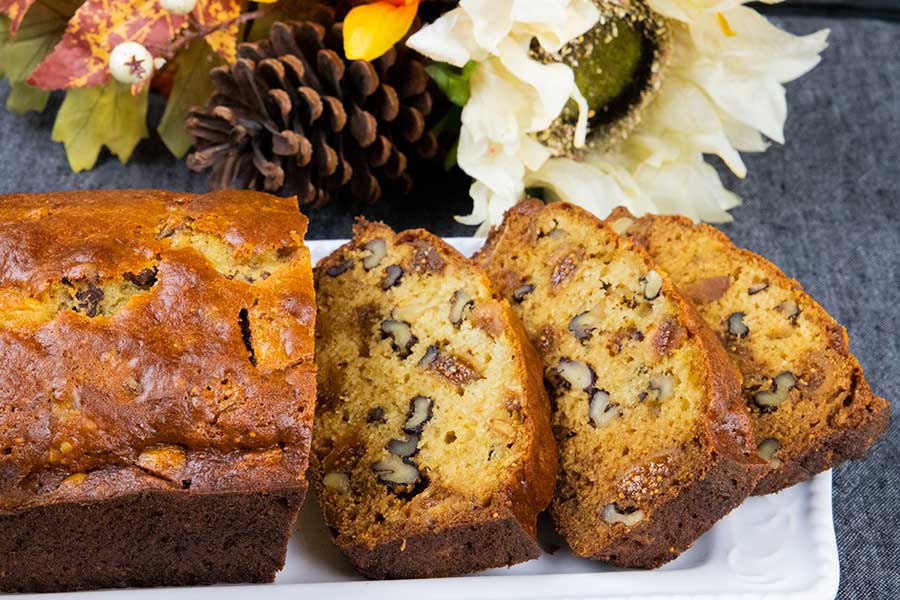 Walnut fig bread on a white platter.