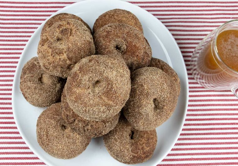 apple cider donuts on a white platter