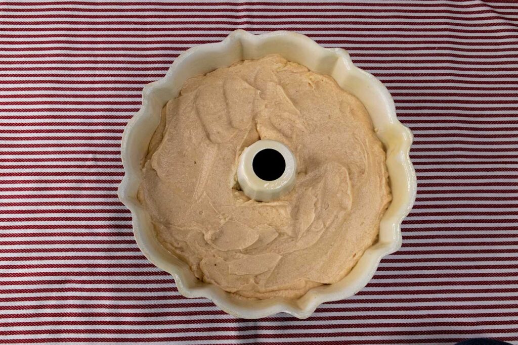 apple cider pound cake batter in a bundt pan