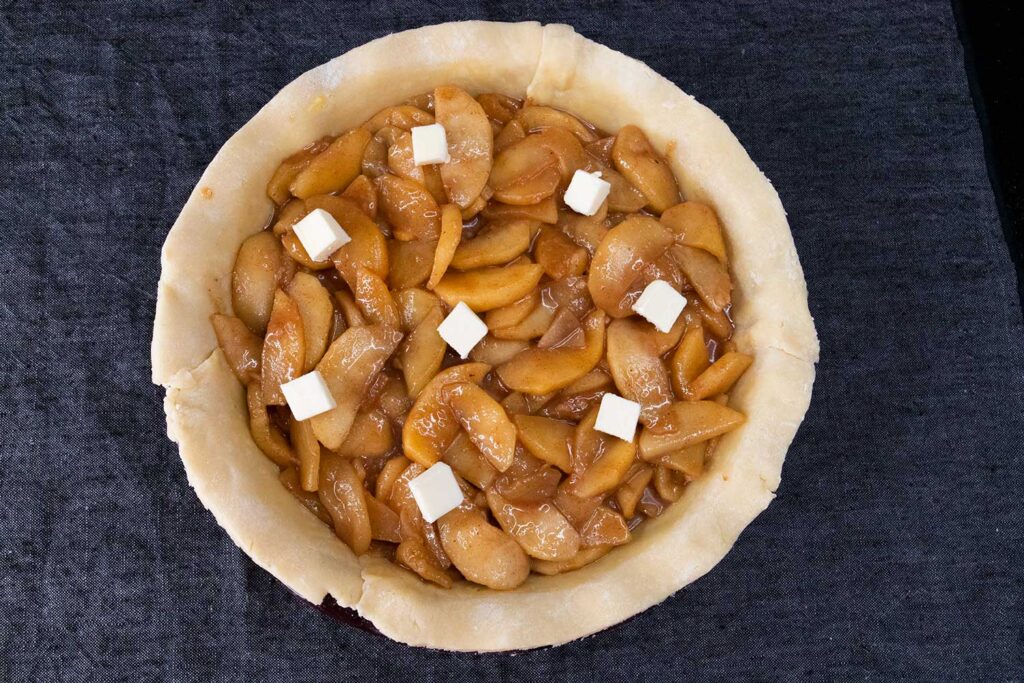 apple pie filling dotted with butter