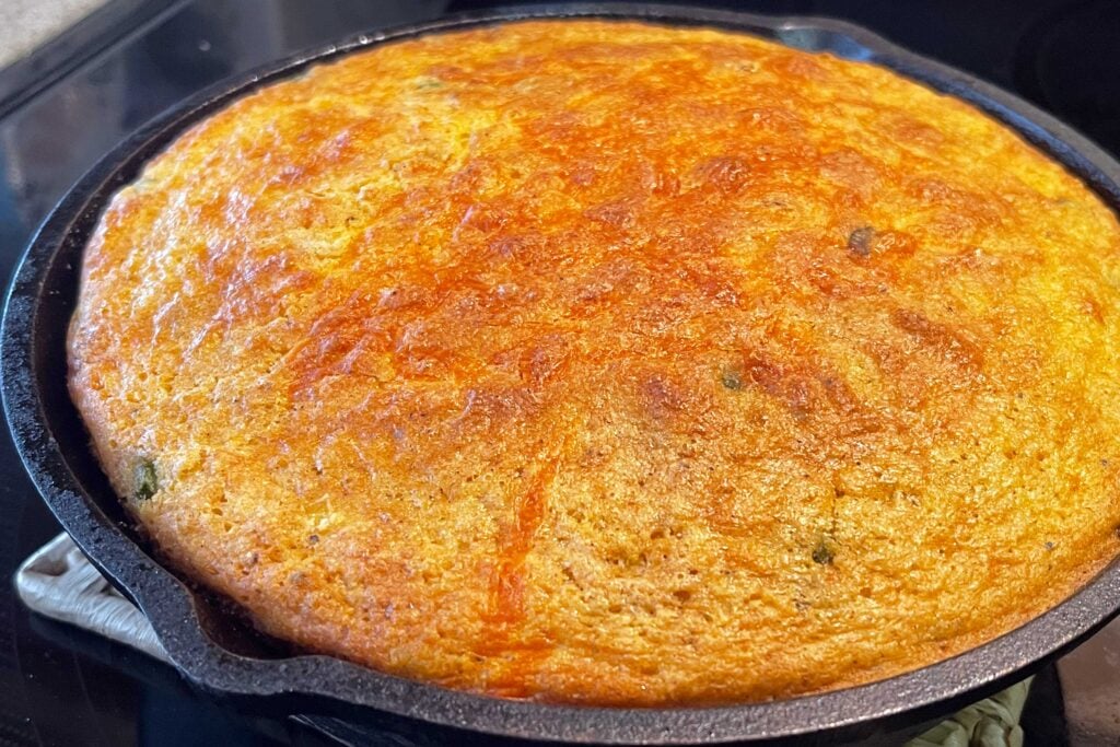 Cooked cornbread in a cast iron skillet