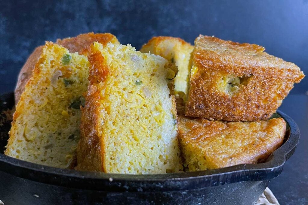 Cornbread wedges in a cast iron skillet
