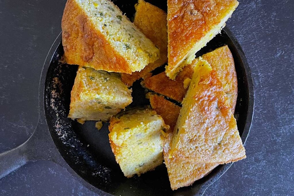 Cornbread wedges in a cast iron skillet