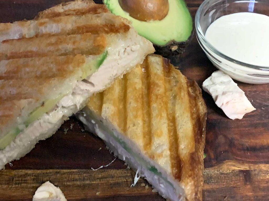 Smoked chicken panini on a cutting board