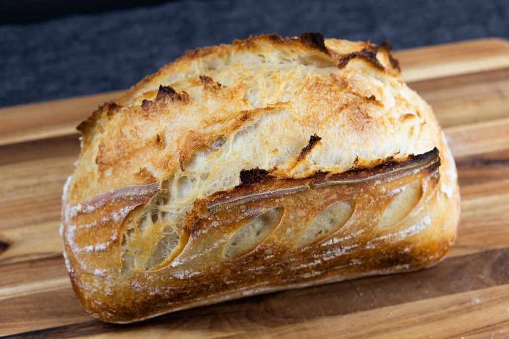 A loaf of sourdough on a cutting board.