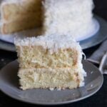 slice of coconut cake on a gray plate