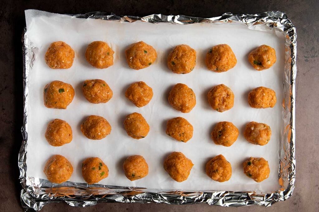 Buffalo chicken meatballs about to go into the oven.