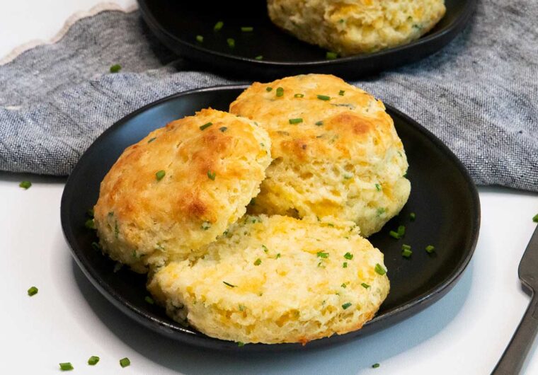 cheddar chive biscuits on black plate