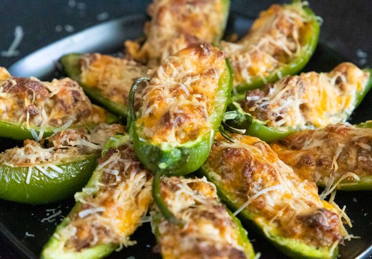 Jalapeno poppers on a black plate