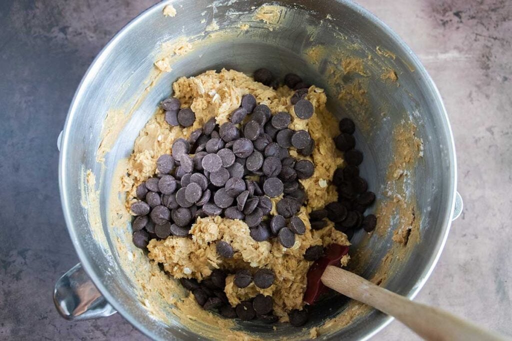 cookie dough in a metal mixing bowl