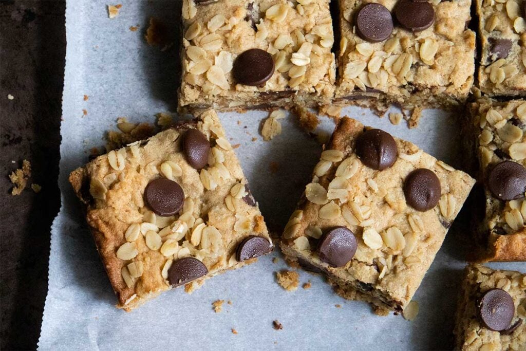 Oatmeal chocolate chip bars on parchment paper.