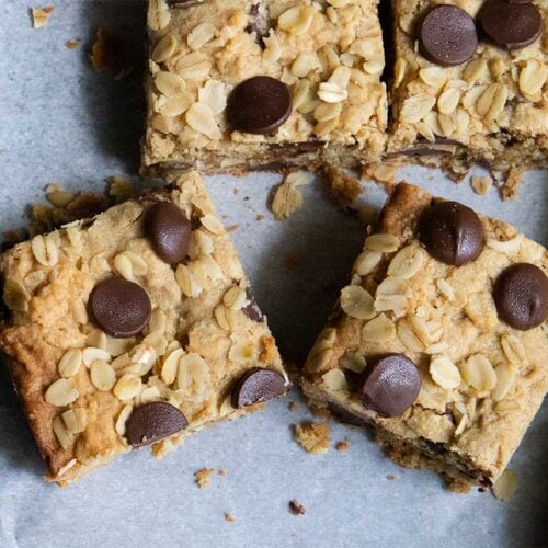 Oatmeal chocolate chip bars on parchment paper.