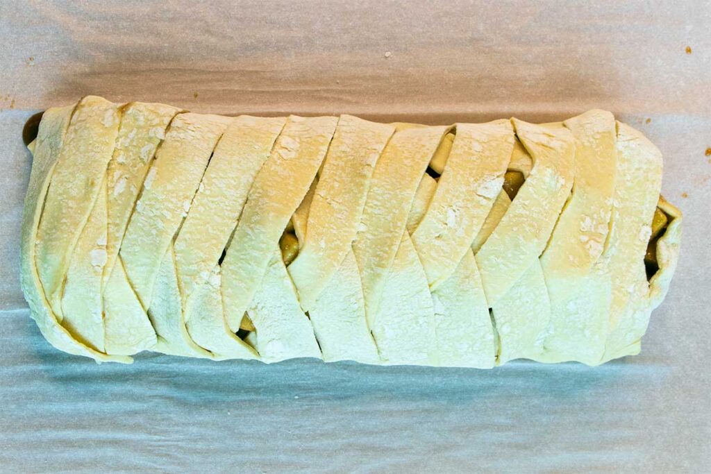 braided pastry on baking sheet