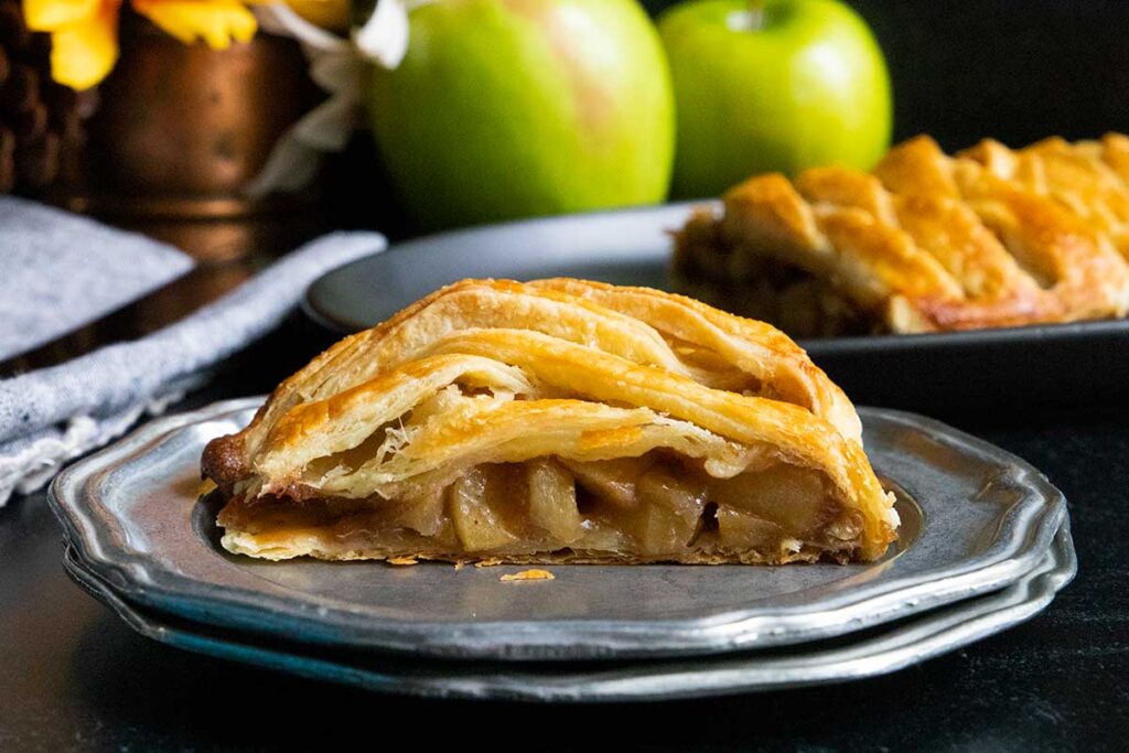 slice of apple strudel on a silver plate