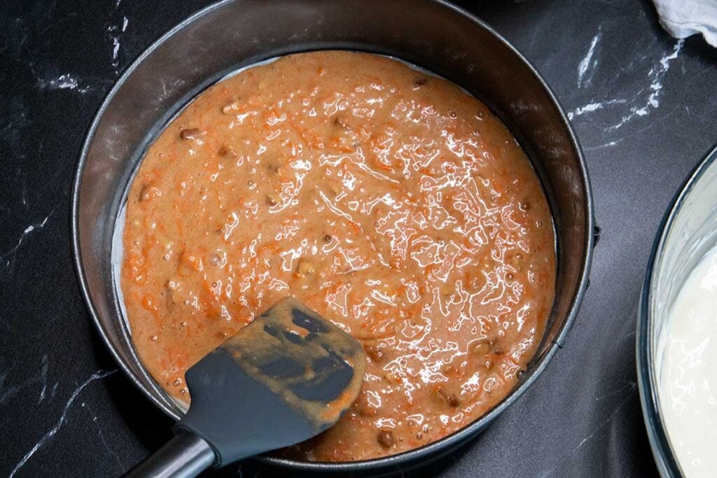 carrot cake batter in springform pan