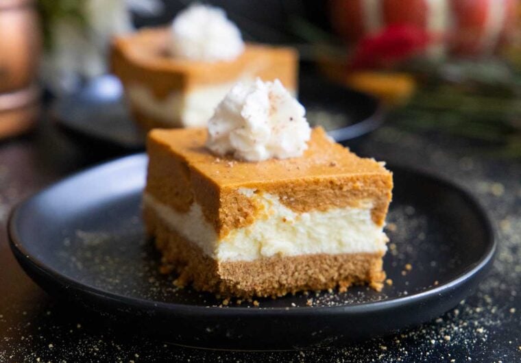 pumpkin cheesecake bar on a black plate