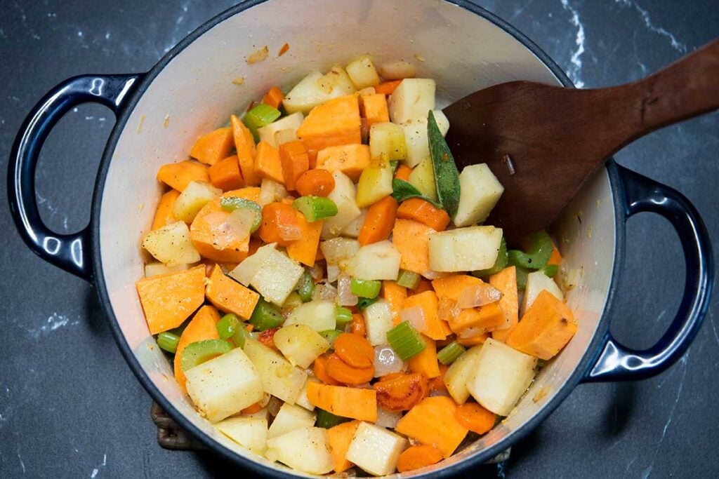 potatoes added to soup pot