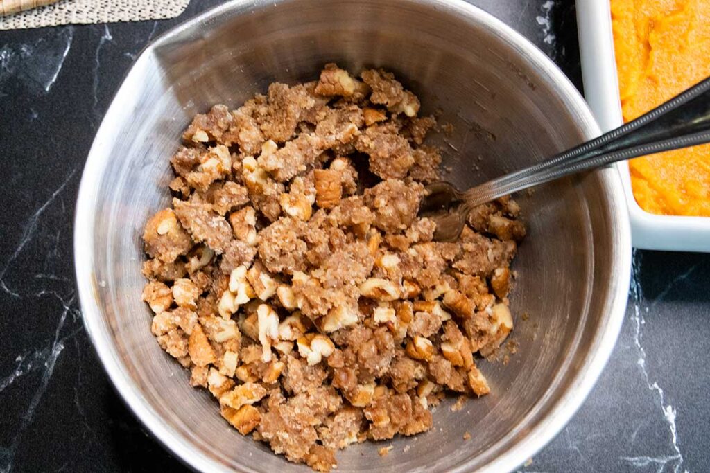 Crumb topping in a metal mixing bowl.