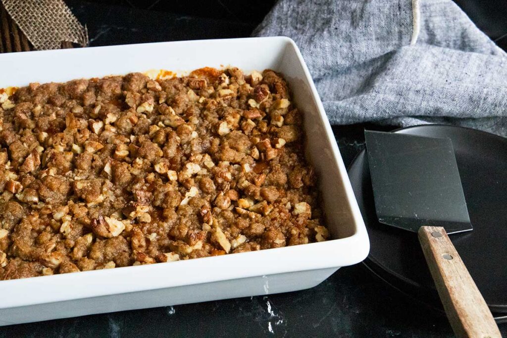 sweet potato casserole in white baking pan