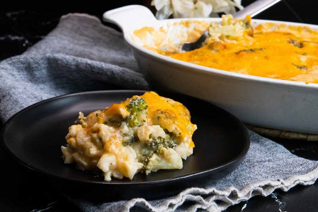 Broccoli rice casserole on black plate.