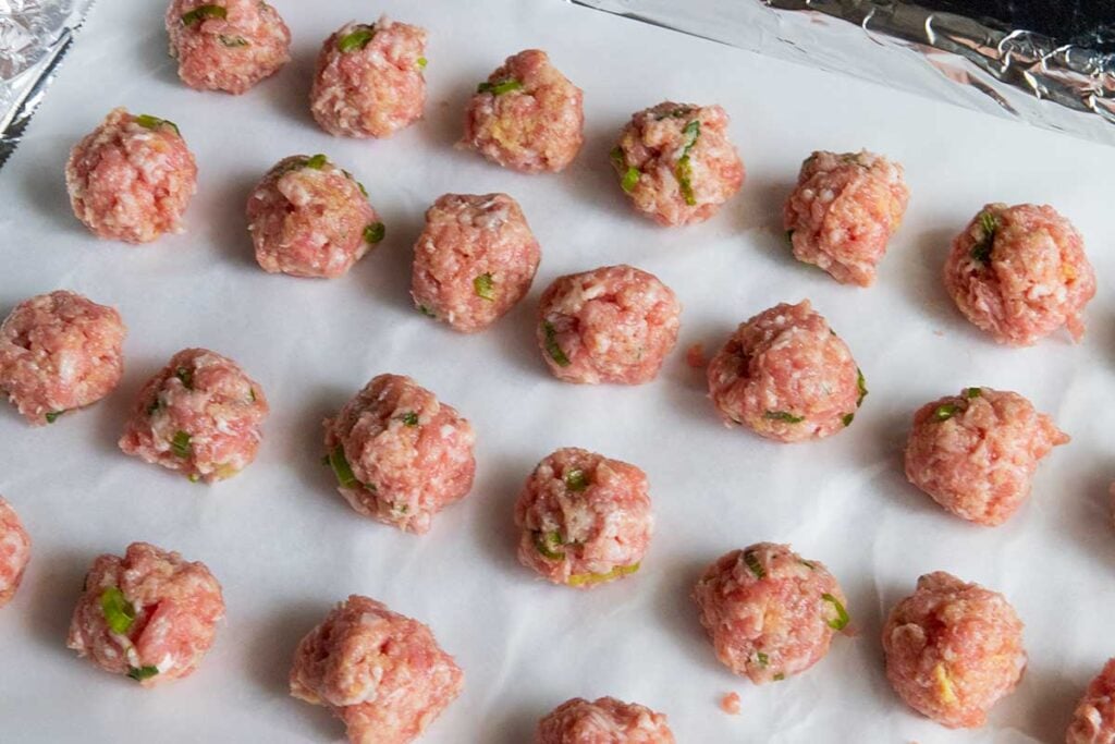raw meatballs on a tray