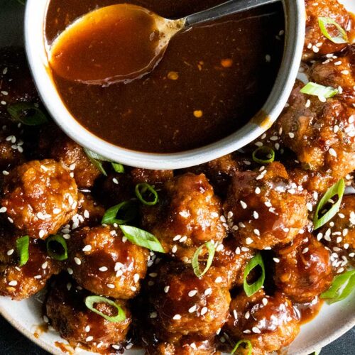 Asian inspired meatballs with sauce.