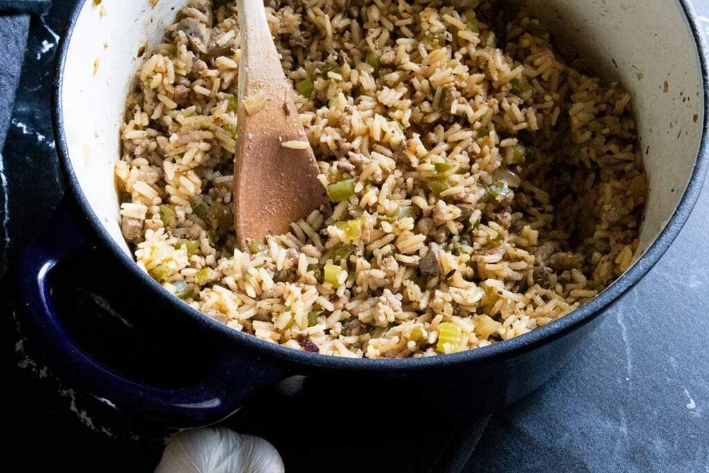 Cajun dirty rice in a blue dutch oven