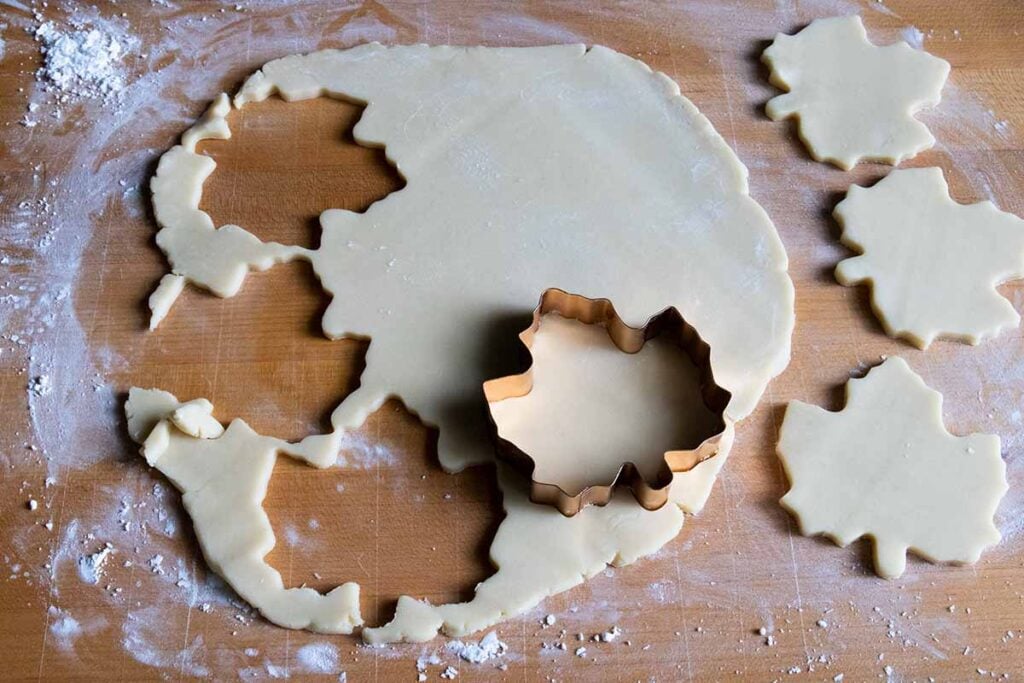 cookie dough cut out on a wooden board