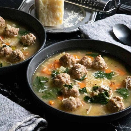 Italian wedding soup in black bowls