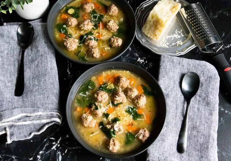 Italian wedding soup in black bowls