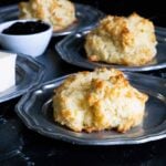 Buttermilk drop biscuits on silver plates.