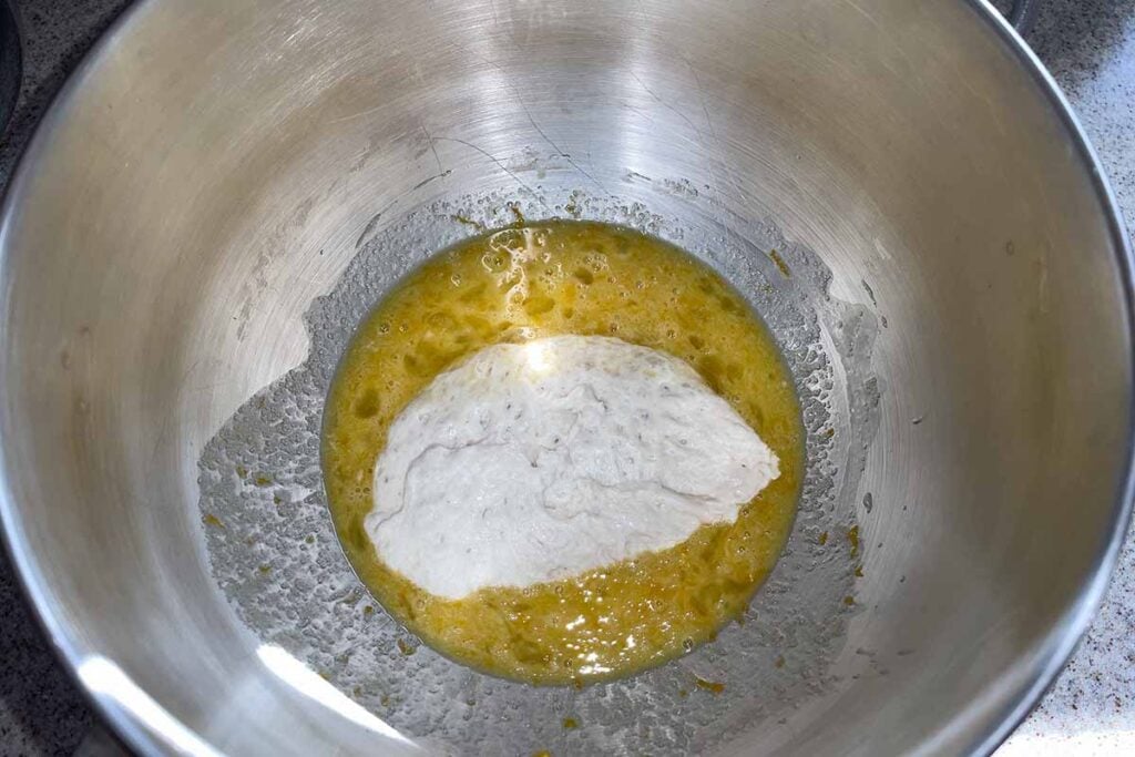 egg mixture with starter added in a mixing bowl