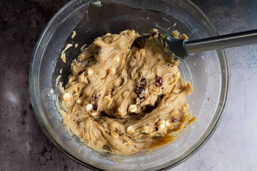 Dough in a glass mixing bowl.